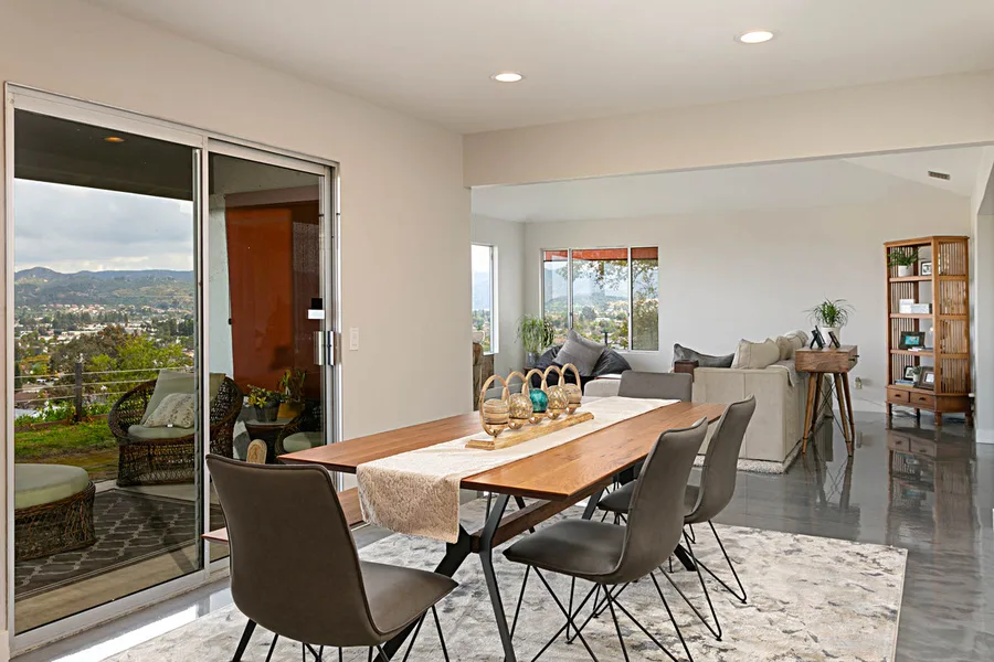 Banyan Project — open-concept dining and living room with hillside view, San Diego