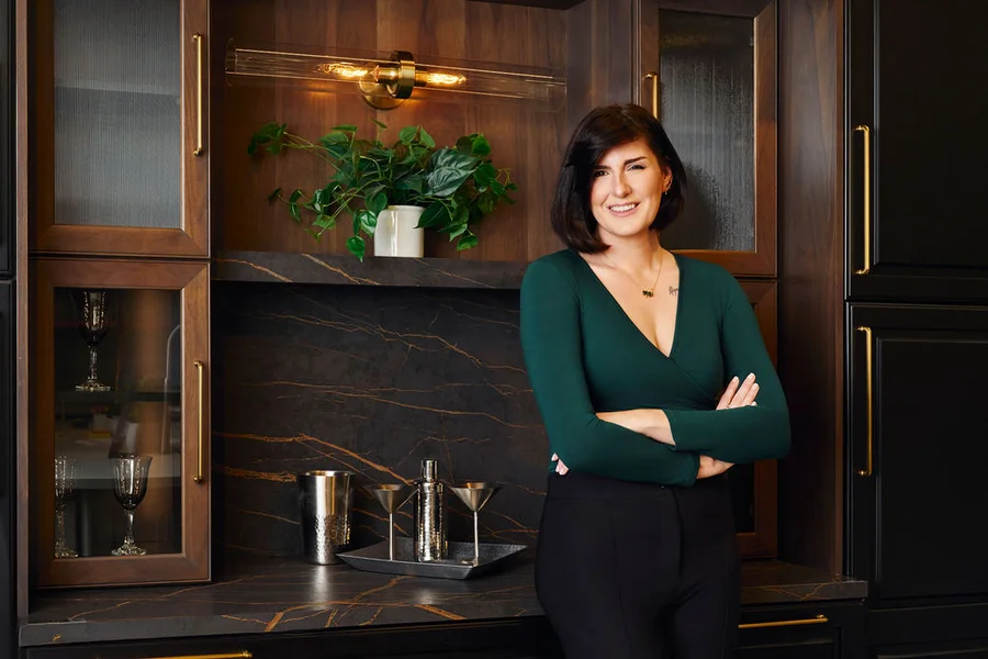 Brittany in a completed custom kitchen and bar design